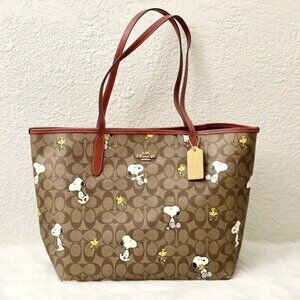 Coach X Peanuts City Tote In Signature Canvas With Snoopy Woodstock Print
